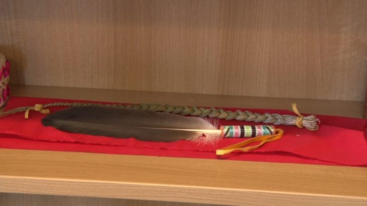 An eagle feather kept by Aaron Prosper on a shelf in his office at the Dalhousie Student Union.