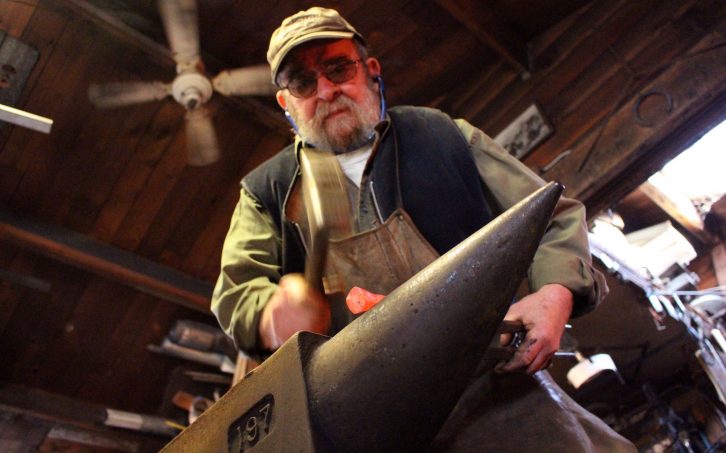 John Little hammers on his anvil in his East Dover forge. He has been blacksmithing for 48 years.