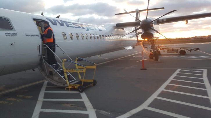 A WestJet airplane sits on the tarmac at the Halifax Stanfield International Airport. 