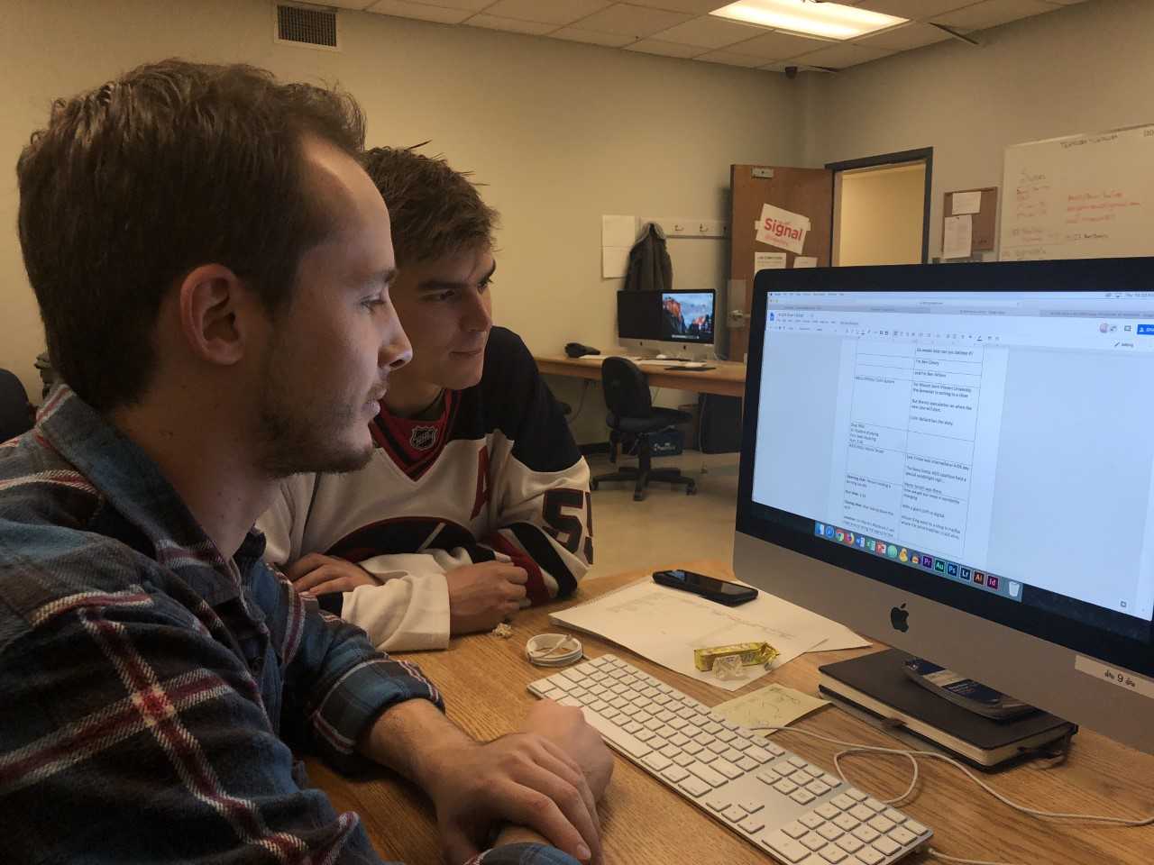 Hosts Ben Cleary and Benjamin Wilson working on scripts for today's final livestream from The Signal's video workshop