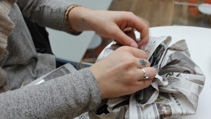 When it comes to wrapping presents, sustainability experts urge people to reuse materials, such as newsprint, in order to avoid waste.