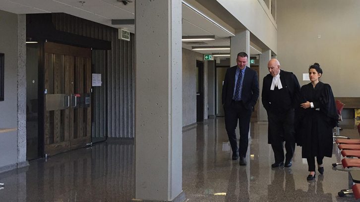 Craig Robert Burnett, left, walks back into Nova Scotia Supreme Court with his legal counsel on Jan 29.