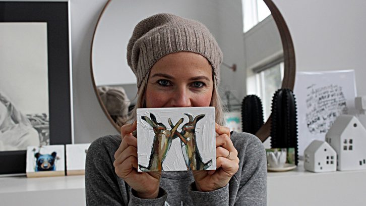 Melissa Townsend holds a piece featured in Pre-Shrunk 2019.