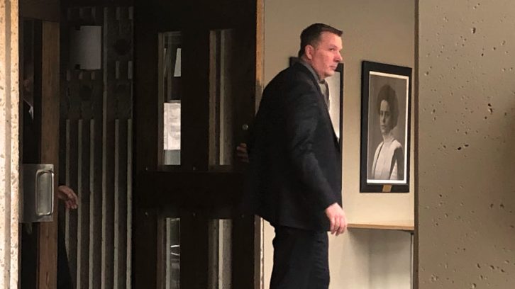 Former RCMP officer Craig Robert Burnett leaves his trial on Feb. 4.