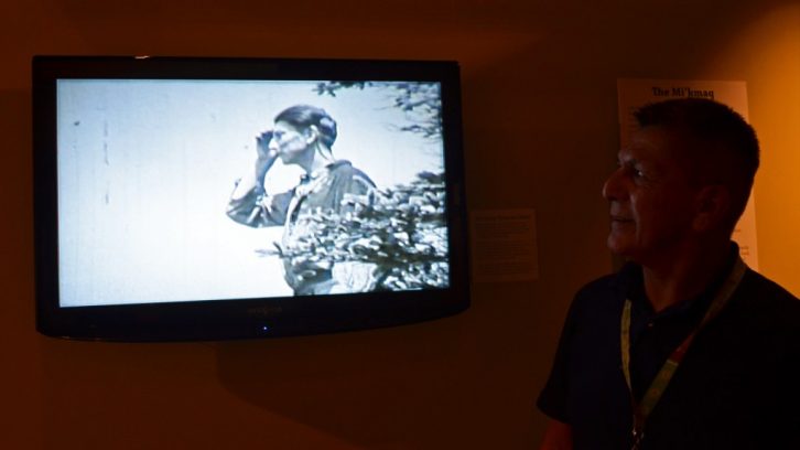 Roger Lewis watches his grandfather in a film on exhibit in the Nova Scotia Museum of Natural History. For Lewis, the history of his people, the Mi’kmaq, is part of his life every day. 