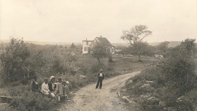 A home and group of children in North Preston.