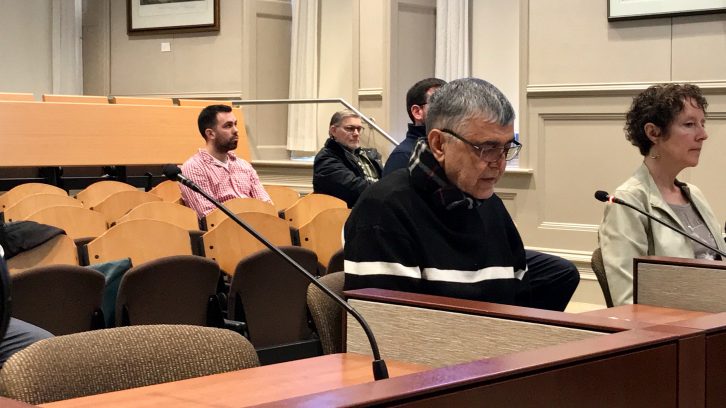 Seyed Lavasani, 74, reads a letter to the appeals committee on Feb. 14, regarding his taxi driver license suspension.