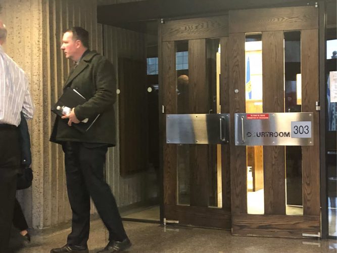 Ex-RCMP officer Craig Robert Burnett leaves court on Feb. 5.