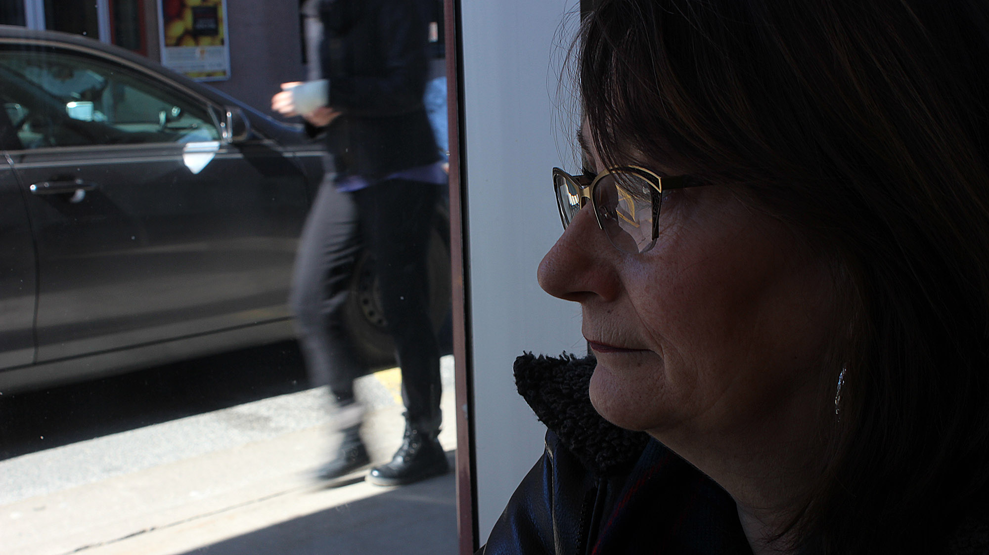 Susan Doyle stares out a window at the QEII Health Sciences Centre