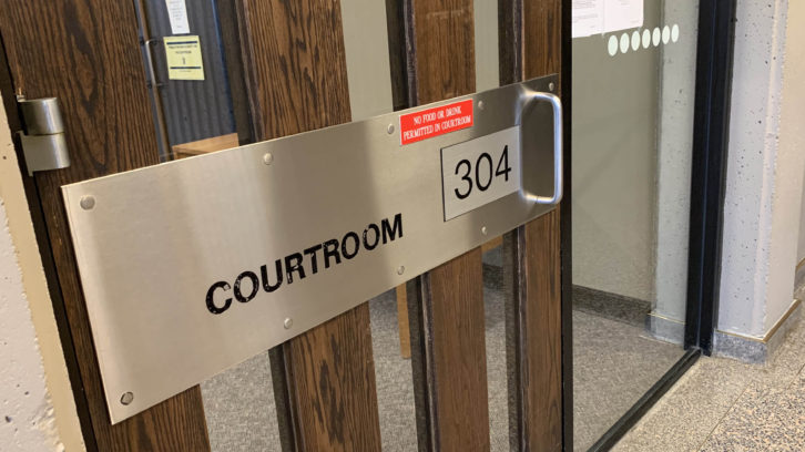 The sign on the courtroom's door, Dec. 3. 