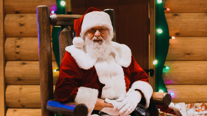Floyd Blakeney sits in his holiday throne greeting children at Cabela's in Dartmouth.