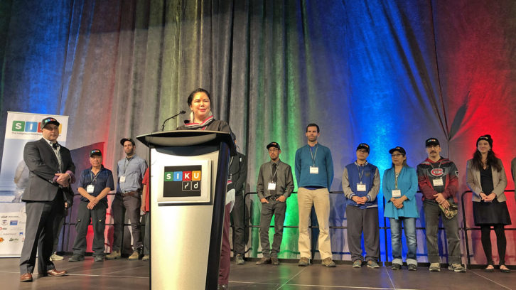 Candice Pedersen, SIKU team member, is joined by the rest of the SIKU team on stage at the Halifax Convention Centre.