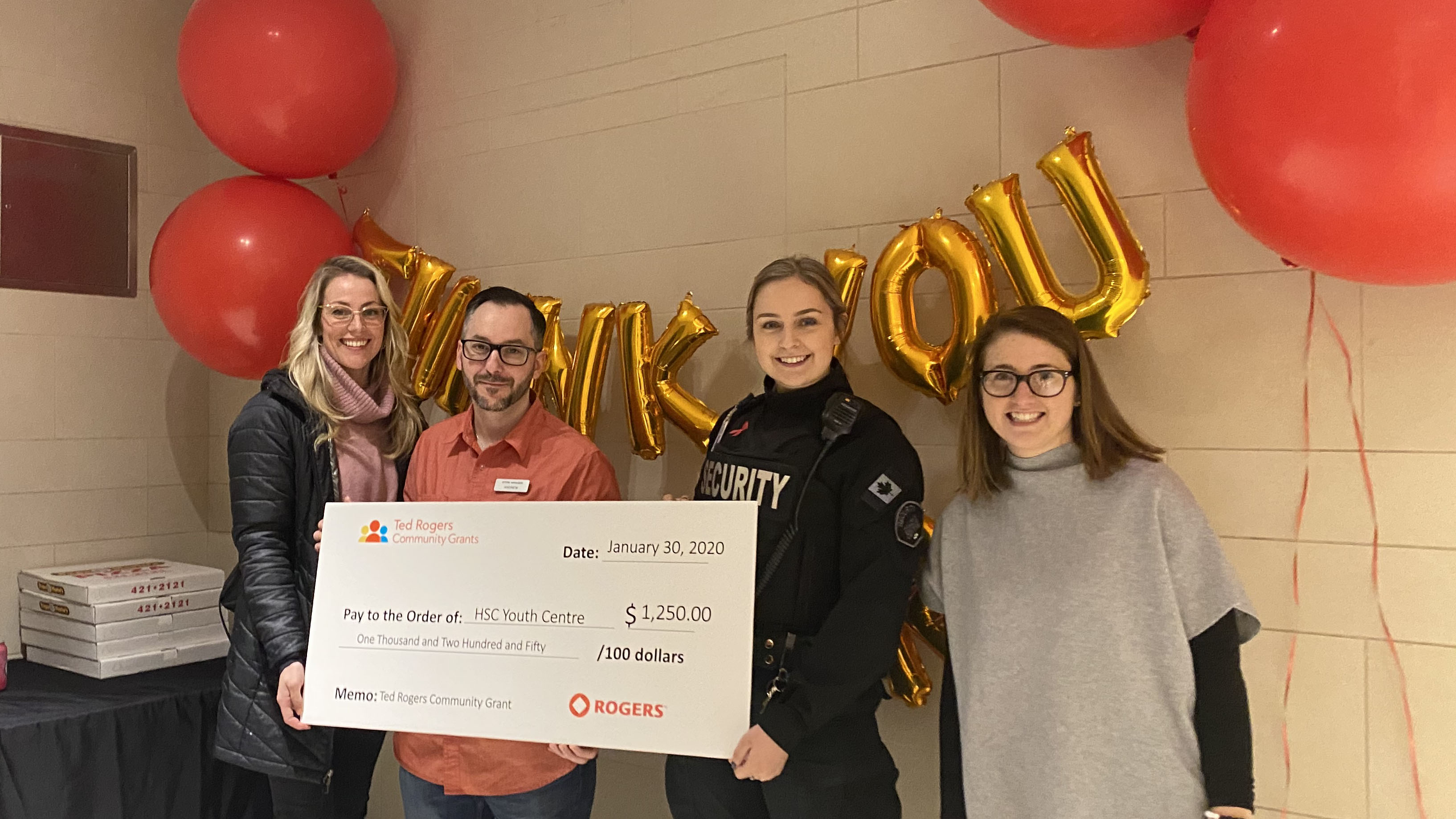 From Left: Carrie-Anne Turner, Andrew Ward awarded a cheque to Lauren Vatcher and Stephanie Schnare to continue the work they are doing at The Centre.