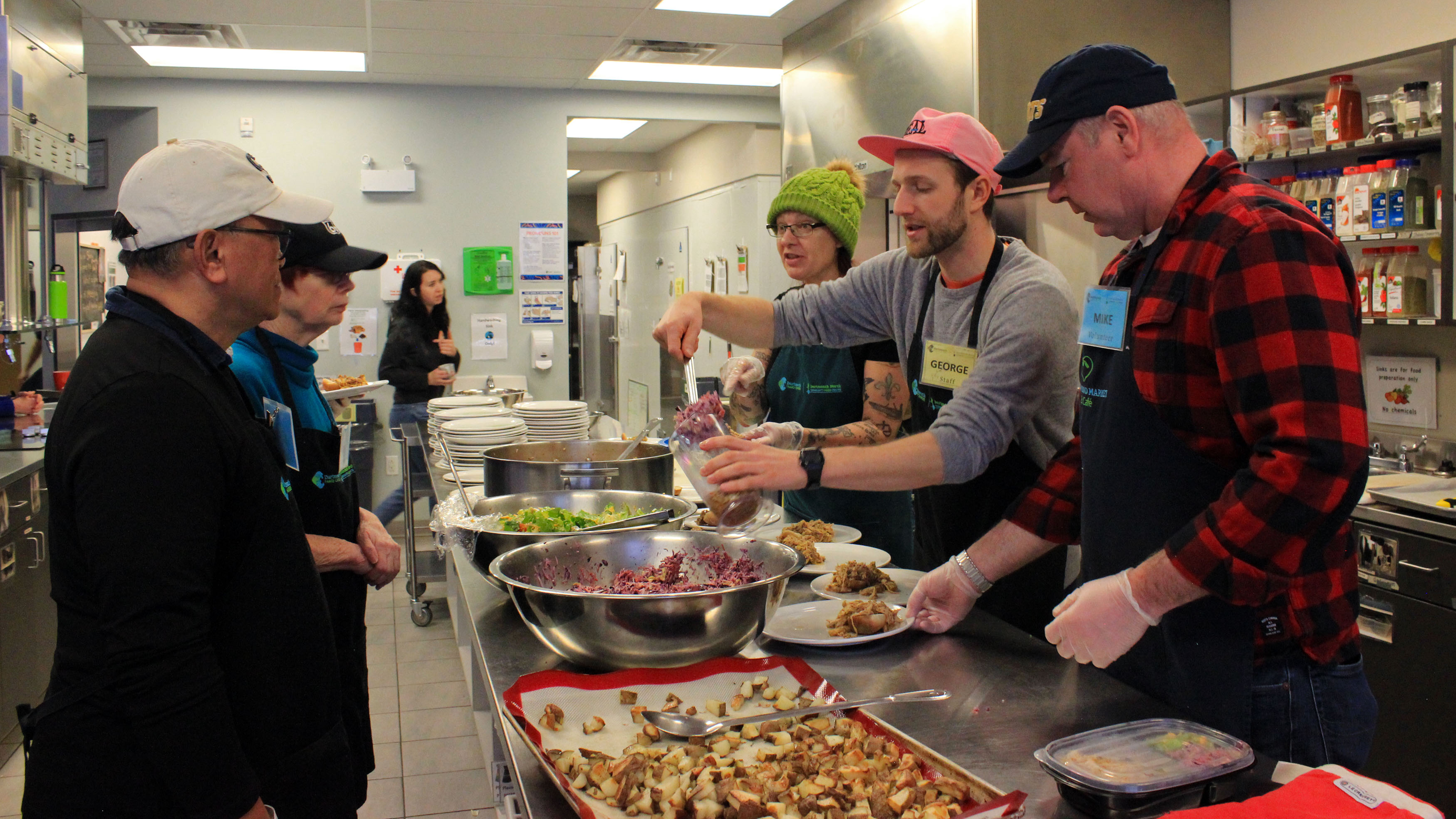 Food access coordinator George Shannon (second from right), leads a team of volunteers who help prepare community meals three days a week at the Dartmouth North Community Food Centre.