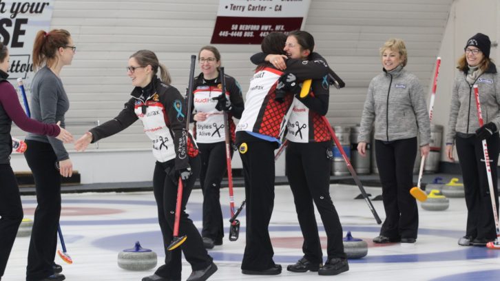 Mary-Anne Arsenault and Emma Logan embrace as their team wins the 2020 Nova Scotia Scotties Tournament of Hearts.