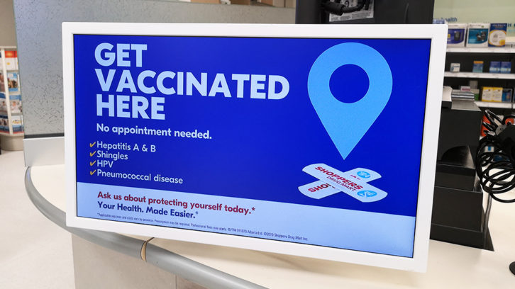 A sign advertising vaccines at a Shoppers Drug Market in Halifax.