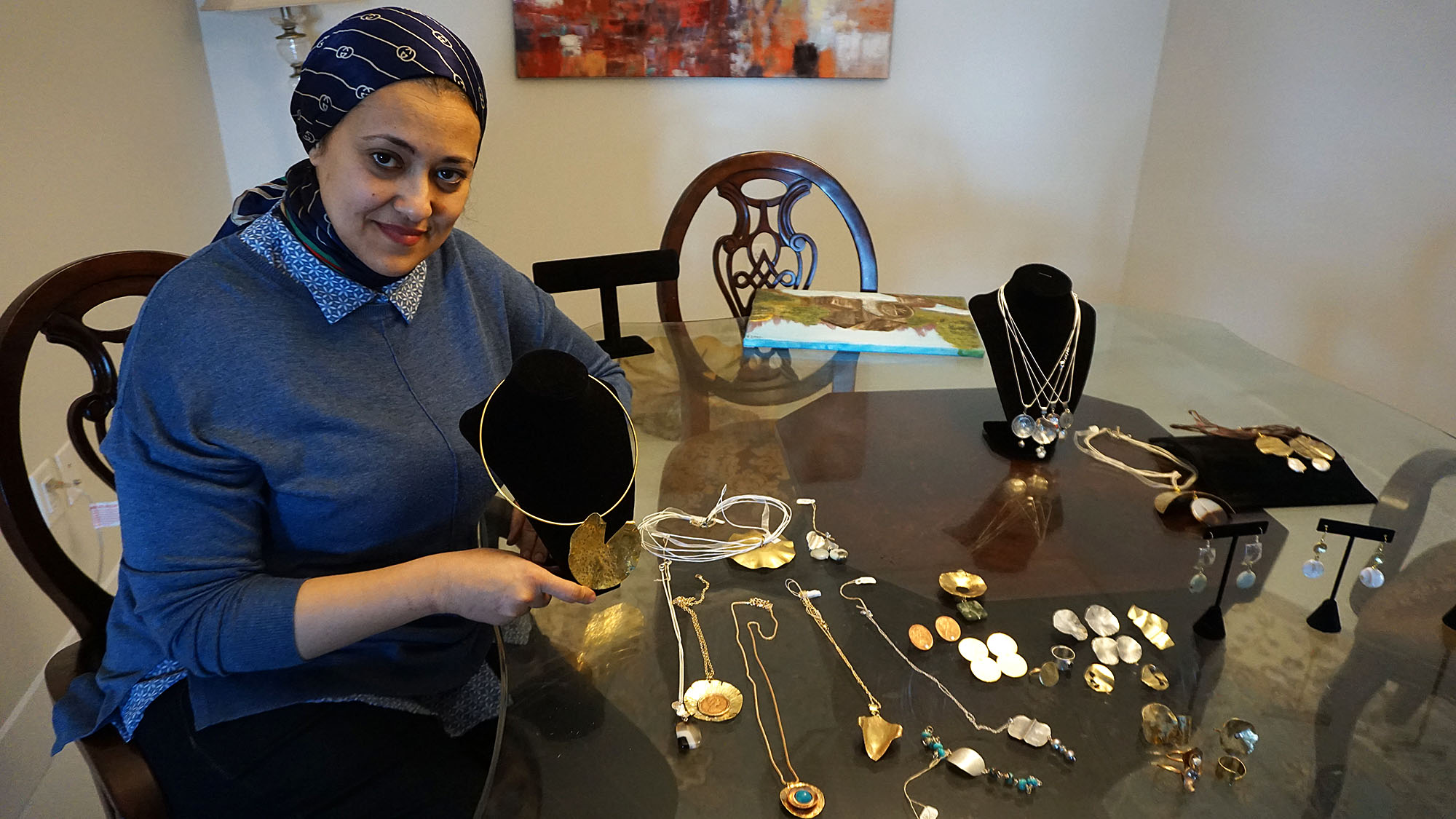 Amal Ragab shows off some of her jewelry that will be on display at the market on Saturday. 