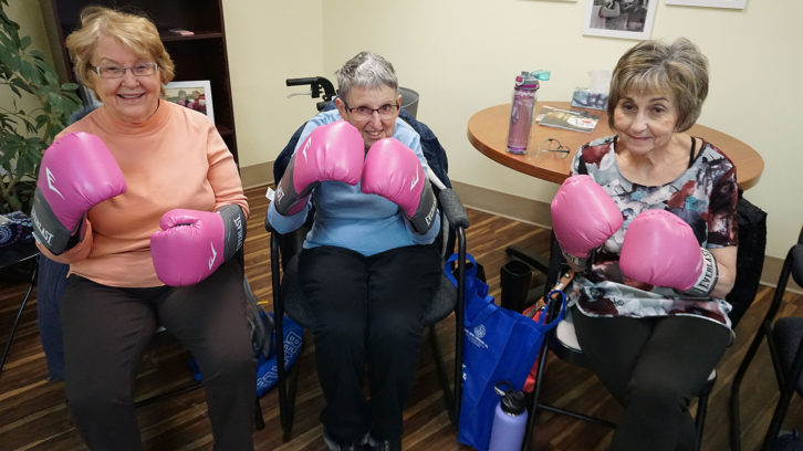 Mary Mclean, Connie Macmillan and Cindy Jussup show off their pink boxing gloves.
