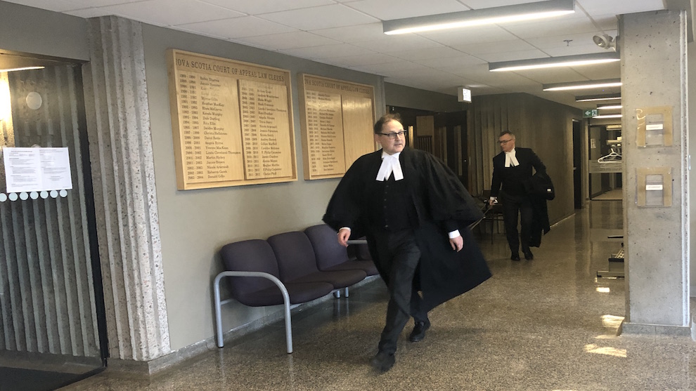 Defence lawyer Ian R. Smith leaves the courtroom Tuesday.