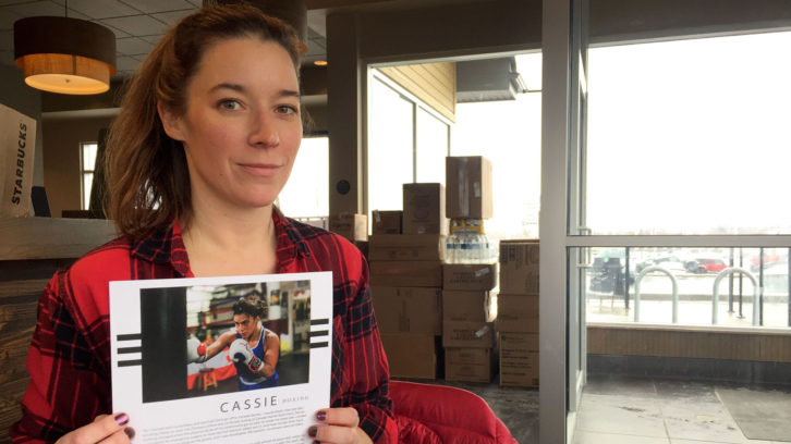 Lyndsay Doyle, 40, sits in sits in Starbucks, holding a page of her upcoming book. 