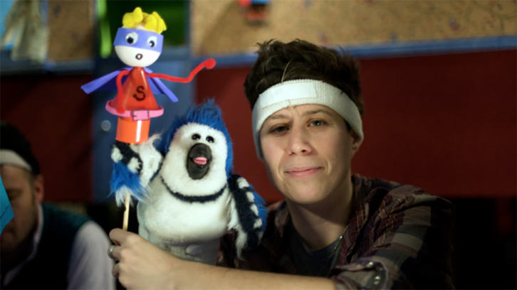 Ali J. Eisner poses with Jay the Blue Jay. 