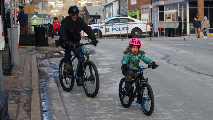Marc Rickard (left) bikes with his daughter Ivy (right) down Portland Street in Dartmouth. They were out for the first day of Winter Bike Week in Halifax, which started Feb. 8.