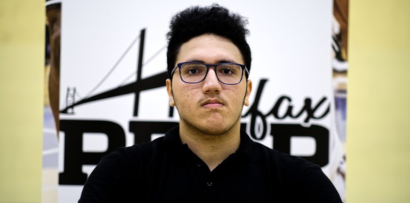 Ali Ragab, 18, poses for a photograph at a practice for his basketball team, Halifax Prep.