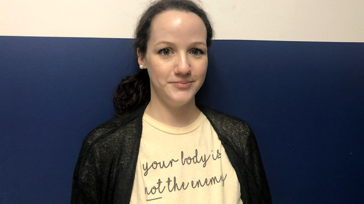 Chasity St. Louis with a shirt that says "your body is not the enemy."