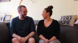Scott Pyke and Erica Brewster sitting in Pyke's living room.