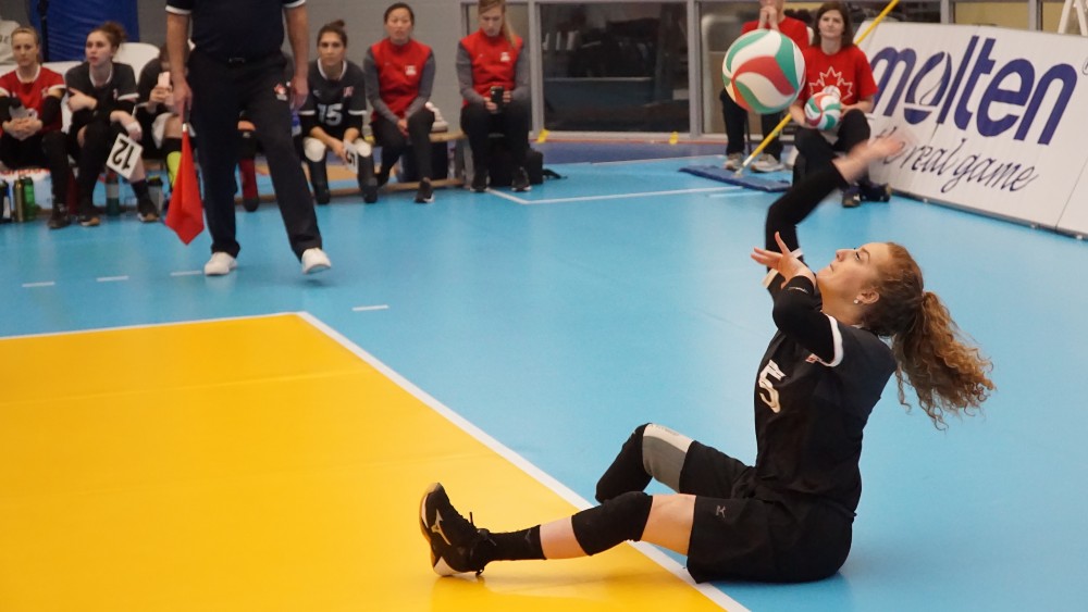 Payden Olsen serves in the final 2020 Paralympic sitting volleyball qualifier.