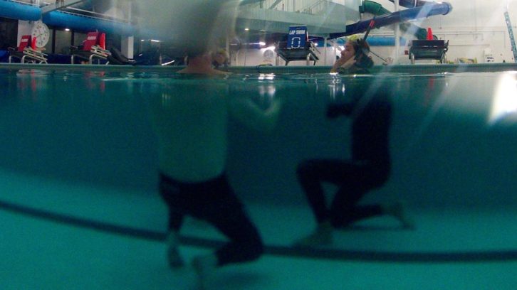 Madison Stewart (right) adjusts her snorkel mask at a freediving learning session in Dartmouth on March 4.