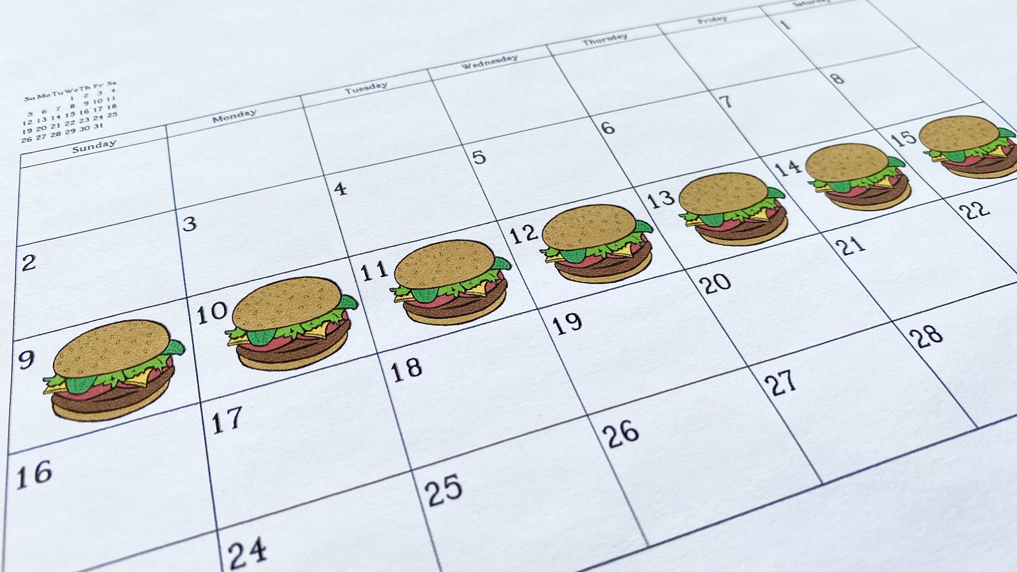 Burgers are seen on a calendar in this photo illustration. 