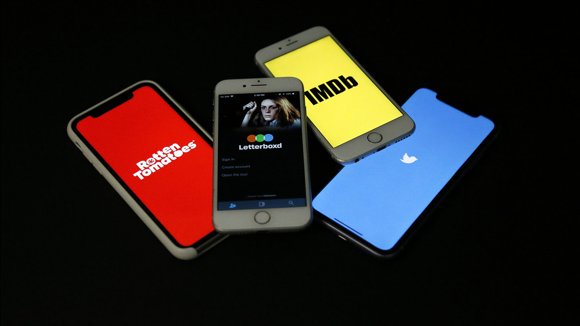 Cellphones show various online movie review sites in this photo illustration.