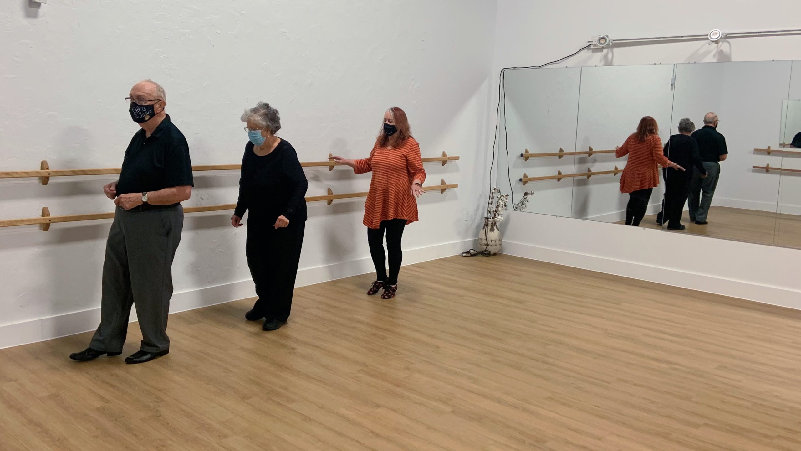 Instructor Cheryl Ewing shows students John and Donna McDermott some choreography at a DanceABLE class at Edgett Dance & Wellness in Halifax.