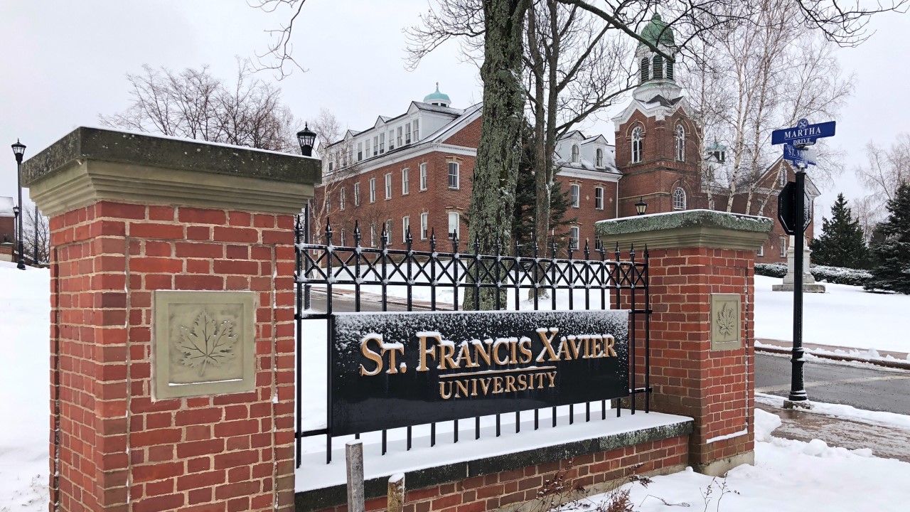 Sign for St. Franics Xavier University is pictured, with Xavier Hall in the background