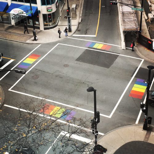 Rainbow crosswalks at the intersection of Spring Garden Road and Queen Street, as seen from the Halifax Central Library