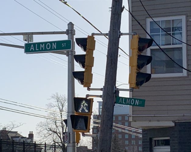 The two signs for Almon Street at its junction with Gottingen Street are a perfect illustration of the difference in effectiveness of both styles of signs. The oversized sign is larger and is mounted over the roadway, while the smaller sign is farther off to the side and harder to read while driving.