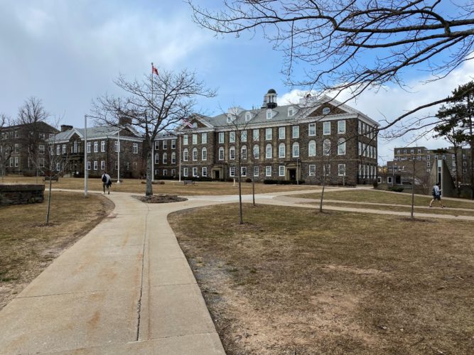 Students stroll through Dalhousie University’s quiet campus on South Street, Halifax NS, on March 14, 2021. The once bustling campus has been left mostly deserted by online learning.