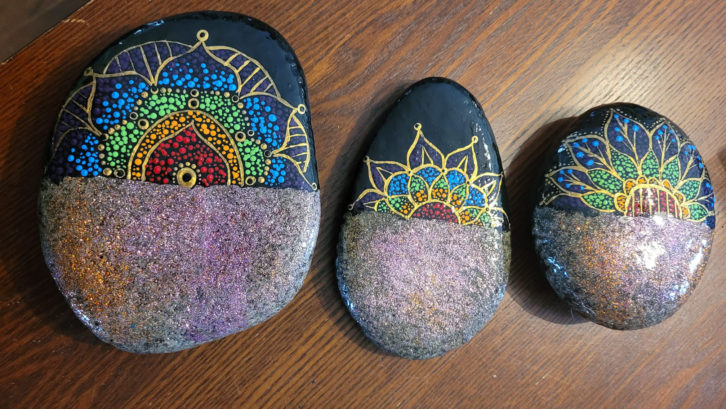 A few rocks Dinn painted with mandalas from her Facebook page