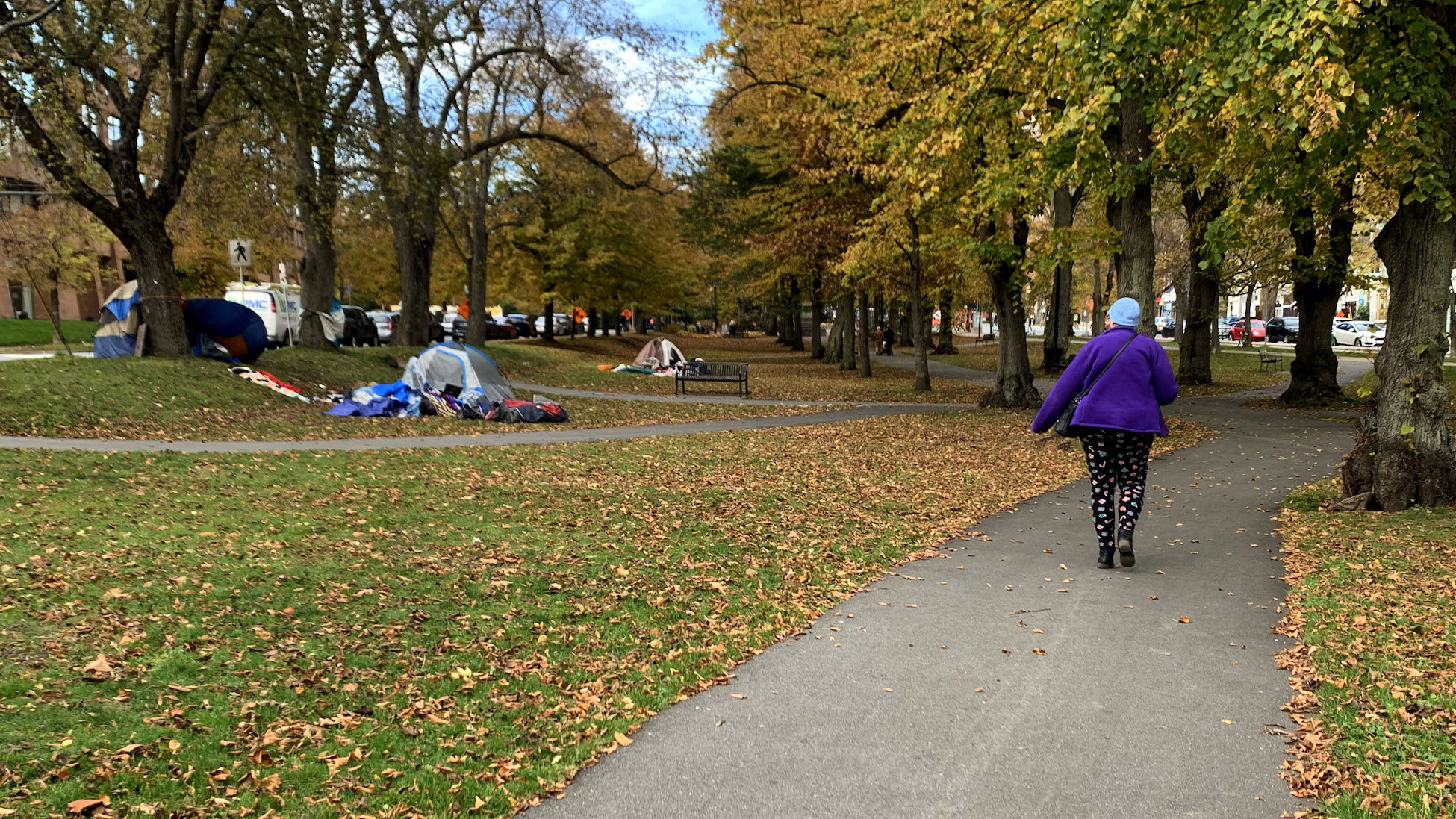 A woman walks past a tent encampment in Victoria Park on Nov. 8, one of several tent communities in HRM.