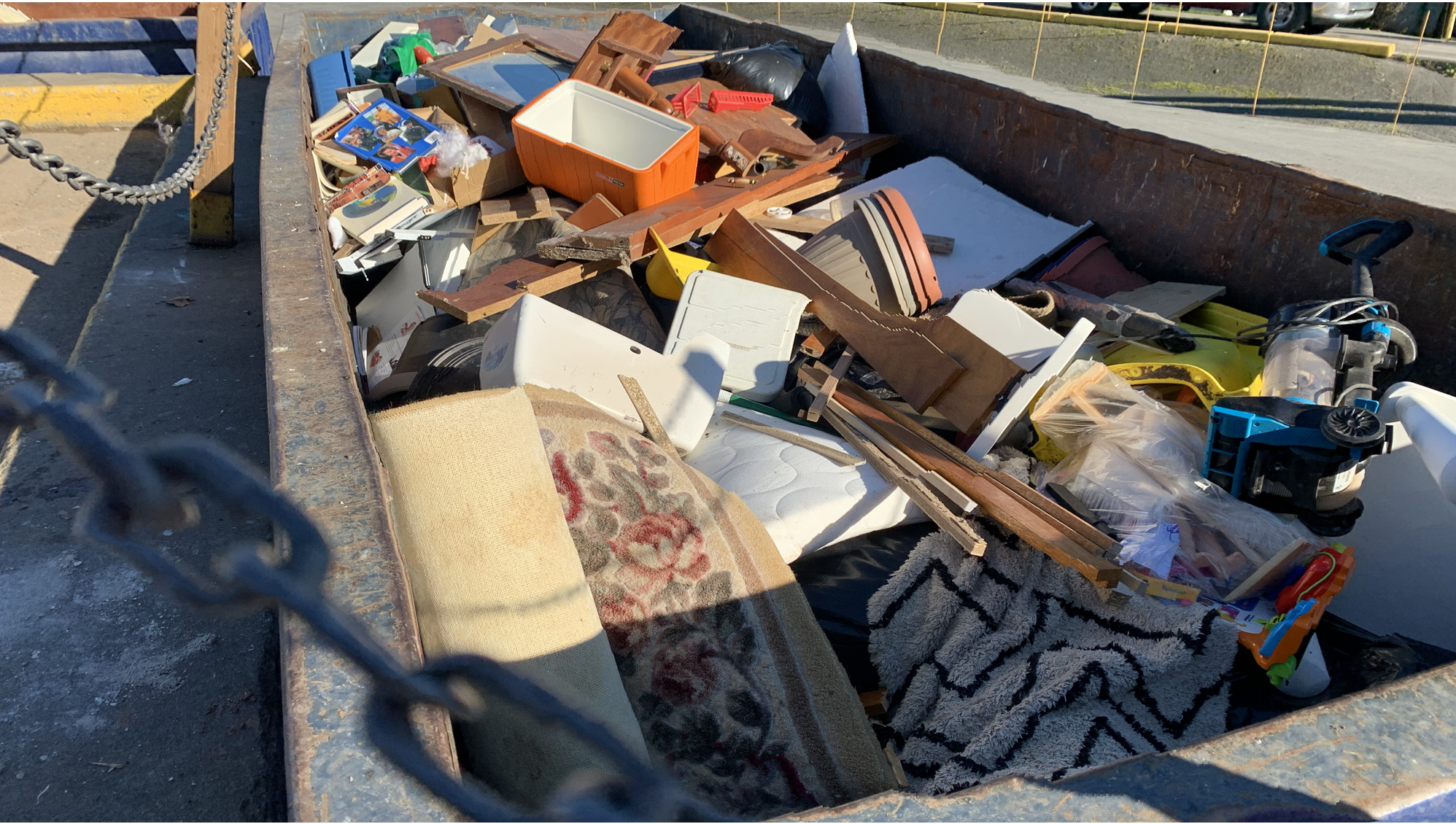 Garbage is seen in a dumpster at Otter Lake landfill on Nov. 6.