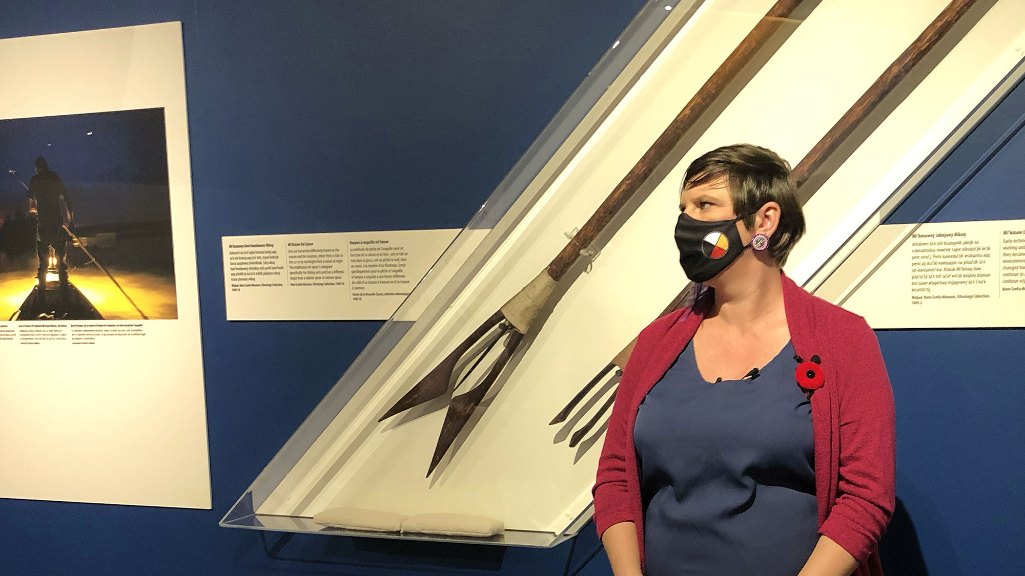 Guest curator Salina Kemp stands beside a display at the Maritime Museum of the Atlantic's new exhibit called Ta’n me’j Tel-keknuo’ltiek