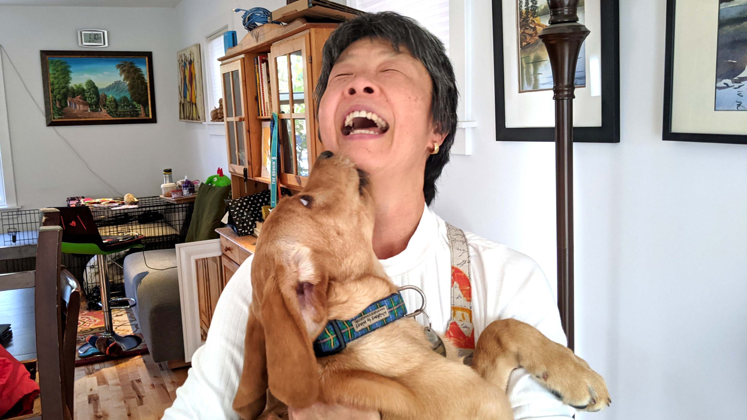 Yuko Imai holds Trapper, her third puppy she has raised for the CNIB.