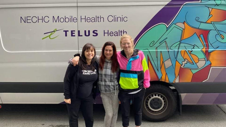Members of Substance User Network of the Atlantic Region stand in front of the Mobile Health Clinic van. From left to right: Jill Harnum, Katie Upham and Emily Wadden.