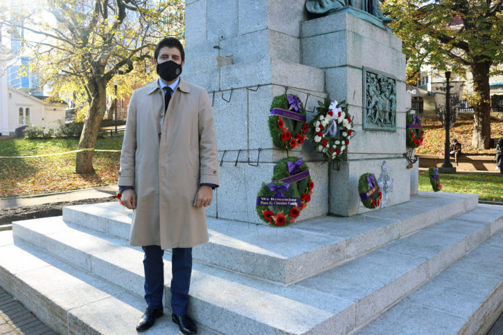 Man next to wreath he placed on cenotaph
