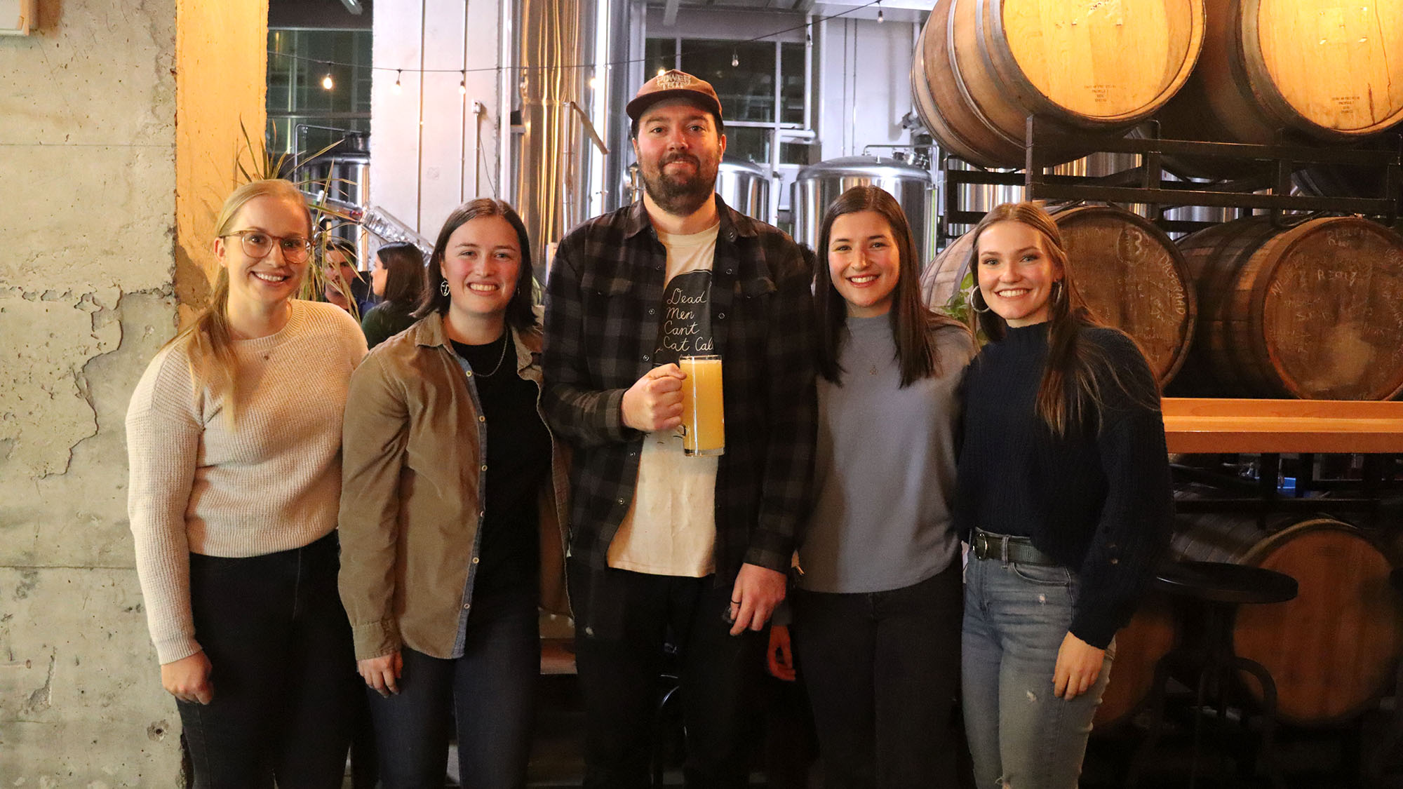 From left to right are Jessica Daigle, Kristin Clarke, Eric Daponte, Emma Logan, and Lindsey Burgess at 2 Crows brewery on Thursday night.