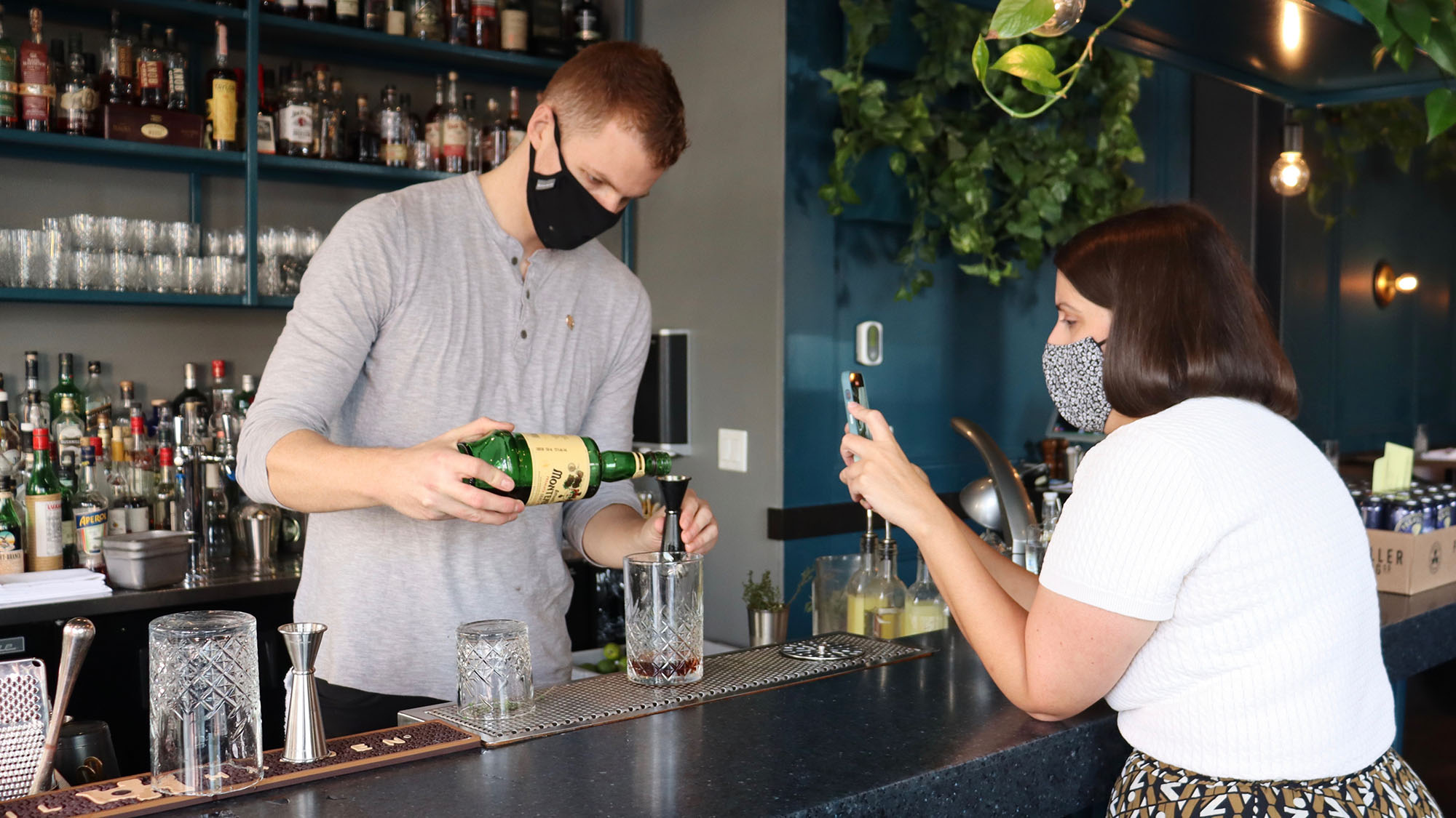 Shannon MacIntyre took videos of Julep Restaurant’s bartender making a cocktail for a photoshoot on Oct. 9. MacIntyre makes the restaurant’s Instagram content.
