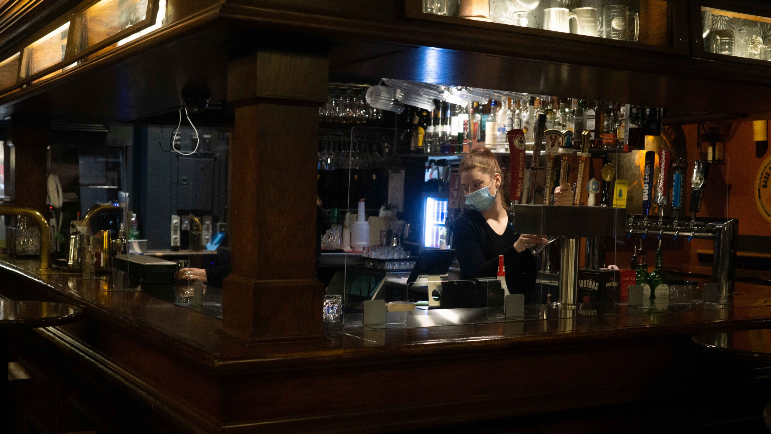 A bartender prepares a drink at Maxwell's Plum in Halifax. The new COVID-19 sick pay benefit will help those in industries where paid sick leave is scarce, such as food service.  