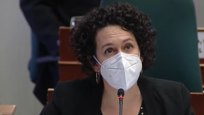 Claudia Chender is shown wearing a mask during a meeting at the Nova Scotia Legislature.