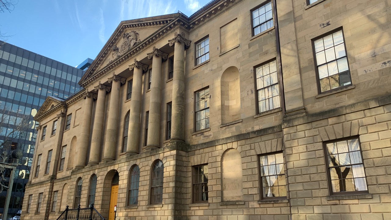 The Nova Scotia Legislature building is shown.